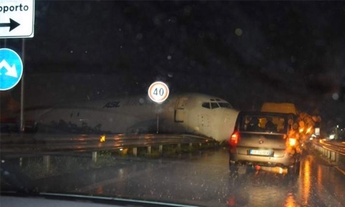 Cargo plane skids off runway, crashes on to road Cargo plane skids off runway, crashes on to road
