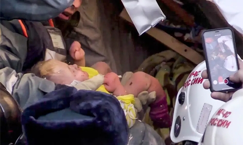 Rescuers pull baby alive from Russian block after gas blast Rescuers pull baby alive from Russian block after gas blast