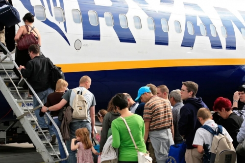 UK probes Ryanair over fees for parents to sit with children UK probes Ryanair over fees for parents to sit with children