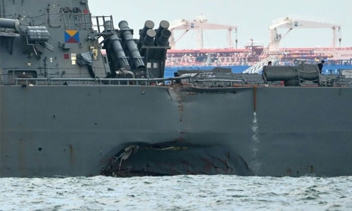 Remains found on US warship that collided off Singapore