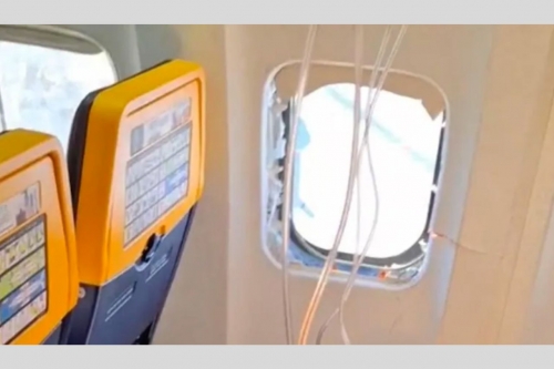 Man nearly sucked out of 'detached' window on Ryanair flight Man nearly sucked out of 'detached' window on Ryanair flight