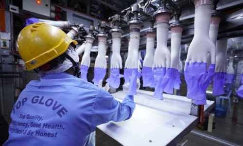 Virus outbreak delays production at world’s top glove maker