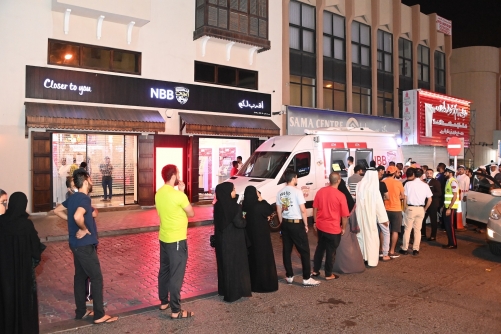 Customers withdraw new Eid Notes from NBB’s ATM Van Customers withdraw new Eid Notes from NBB’s ATM Van