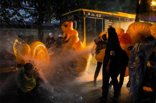 Thai police fire water cannon, teargas at parliament protest