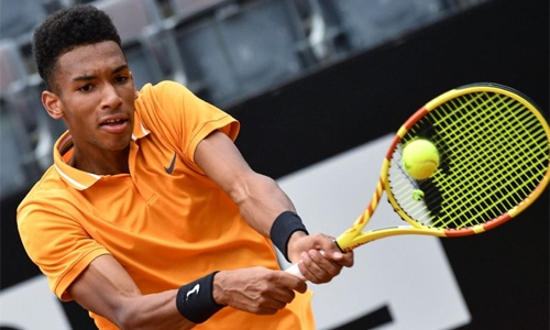 Teenage talent Auger-Aliassime records first ATP win on grass