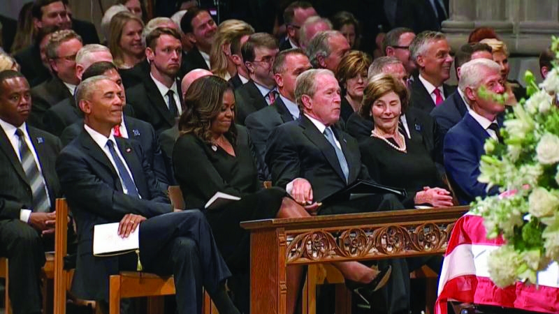 Bush slipped a piece of candy to Michelle Obama at McCain’s funeral 