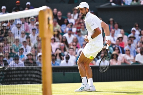 Djokovic makes Wimbledon history to reach quarter-finals Djokovic makes Wimbledon history to reach quarter-finals