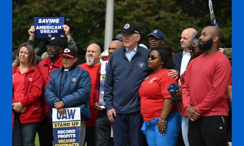 Biden makes history by joining striking US car workers