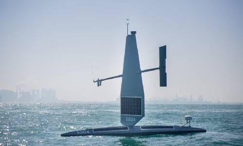 Robotic, 23-foot-long vessel Saildrone resembling torpedo with 15-foot-tall shark fin in Bahrain