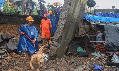Wall collapse kills 18 as monsoon chaos hits Mumbai Wall collapse kills 18 as monsoon chaos hits Mumbai