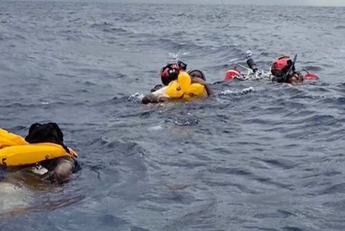 US rescues 11 small plane crash survivors after hours on raft 