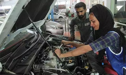 Female car mechanic driving change in Pakistan