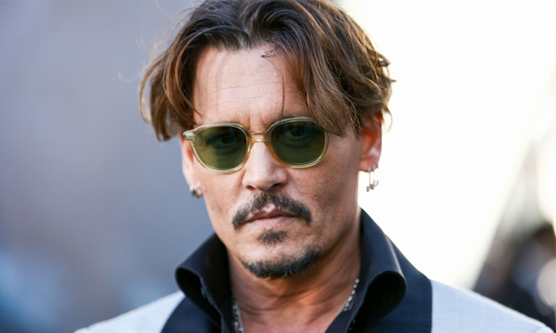 Depp settles fued
