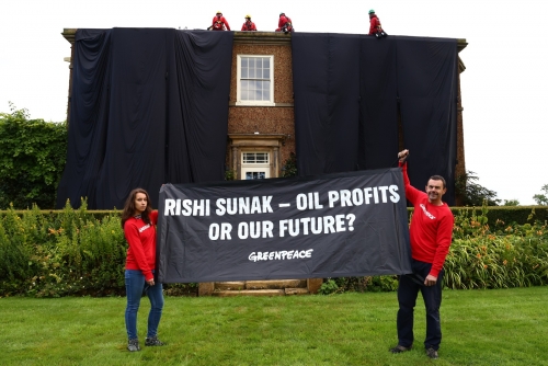Environmental activists cover UK PM Sunak's home in black