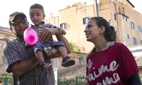 Pope's refugee families settle into Roman life