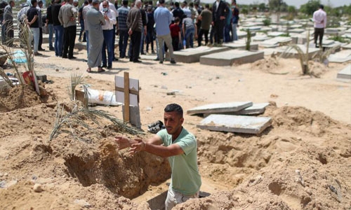 Gaza gravediggers, medics stretched as cases spike in Ramadan