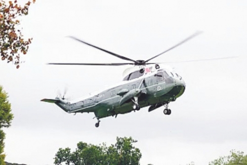 Man charged with shining laser pointer at Trump helicopter Man charged with shining laser pointer at Trump helicopter