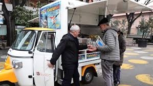 Italy’s three-wheeled newsagent revs up against crisis