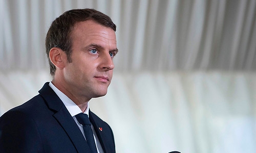 France's Macron unveils tricky first budget