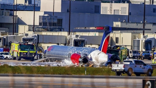 Plane carrying 126 people catches fire after landing in US 