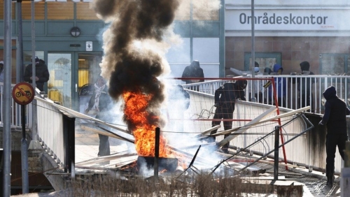 Swedish police arrest two as riot breaks out at Quran burning protest