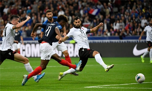 Coman brace helps France ease past Albania