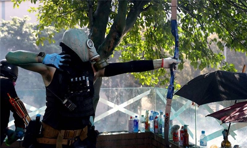 Activists hit Hong Kong police offier with arrow 