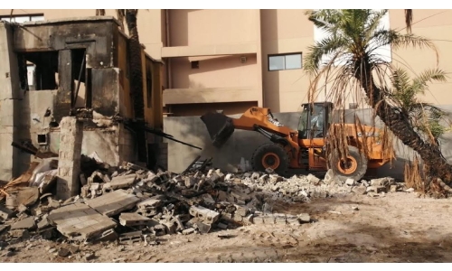 Dilapidated buildings being demolished or restored in Adliya's Block 338 