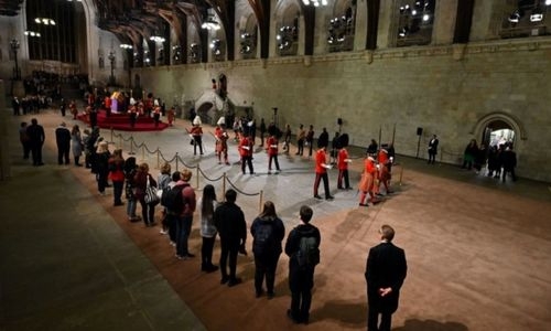 Thousands pass Queen Elizabeth's coffin as she lies in state in London Thousands pass Queen Elizabeth's coffin as she lies in state in London
