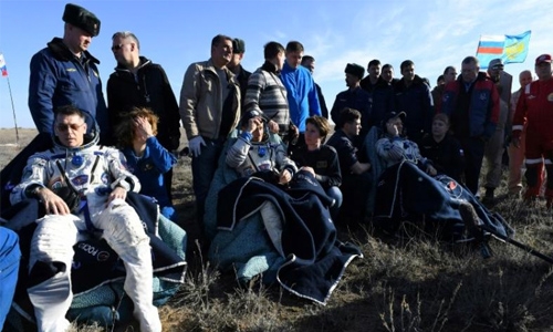 Two Russians, one American land back on Earth from ISS