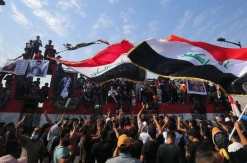 Iraqis rally to relaunch year-old anti-government revolt