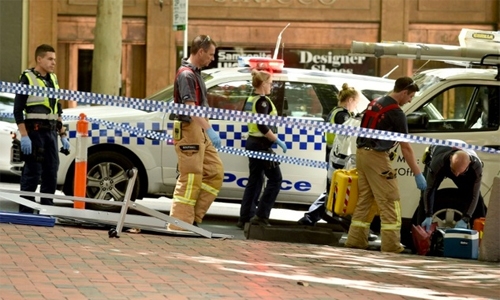 Melbourne vigil for shopping mall dead as suspect charged