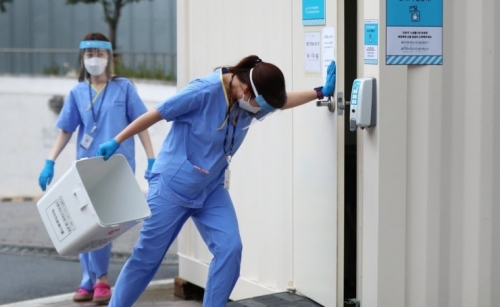 South Korea’s virus cases spike to over 400